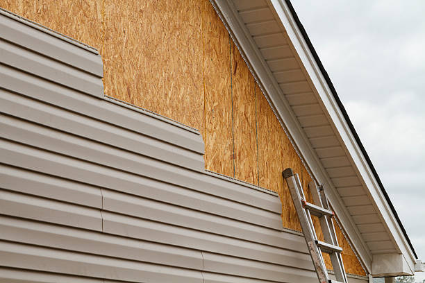 Professional Storm Damage Siding Repair technician working in Sutersville, PA